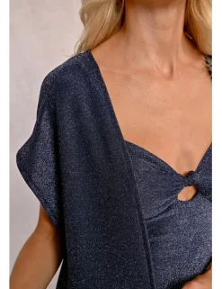 Chaqueta larga en tejido brillante con flecos