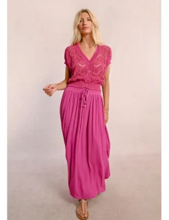 Falda larga plisada con lazada