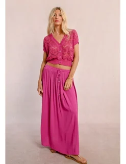 Falda larga plisada con lazada