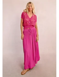 Falda larga plisada con lazada
