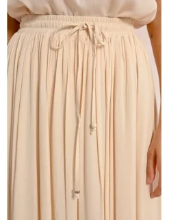 Falda larga plisada con lazada