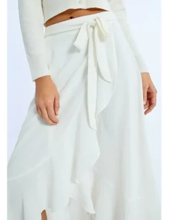 Falda midi asimétrica con volante y lazada