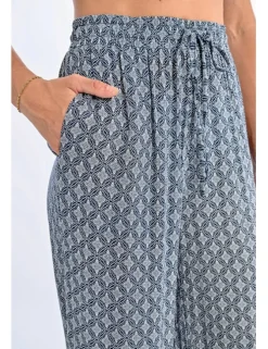 Pantalón largo con estampado y lazada