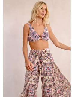 Pantalón largo con lazada y estampado