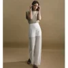 Pantalón largo en tejido bordado y transparencias