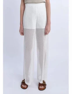 Pantalón largo en tejido bordado y transparencias